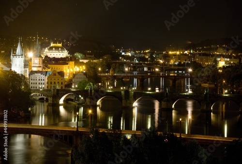 National Theater and bridges over the Vltava river in Prague at night