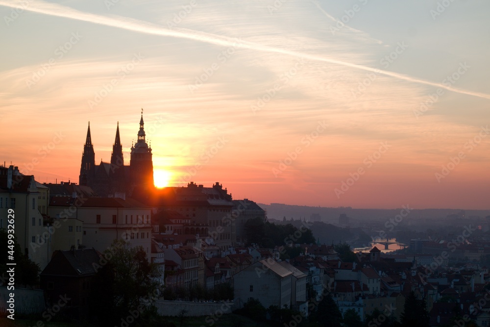 Sun rising behind the St. Vitus Cathedral at Prague Castle Sun rising behind the St. Vitus Cathedral at Prague Castle