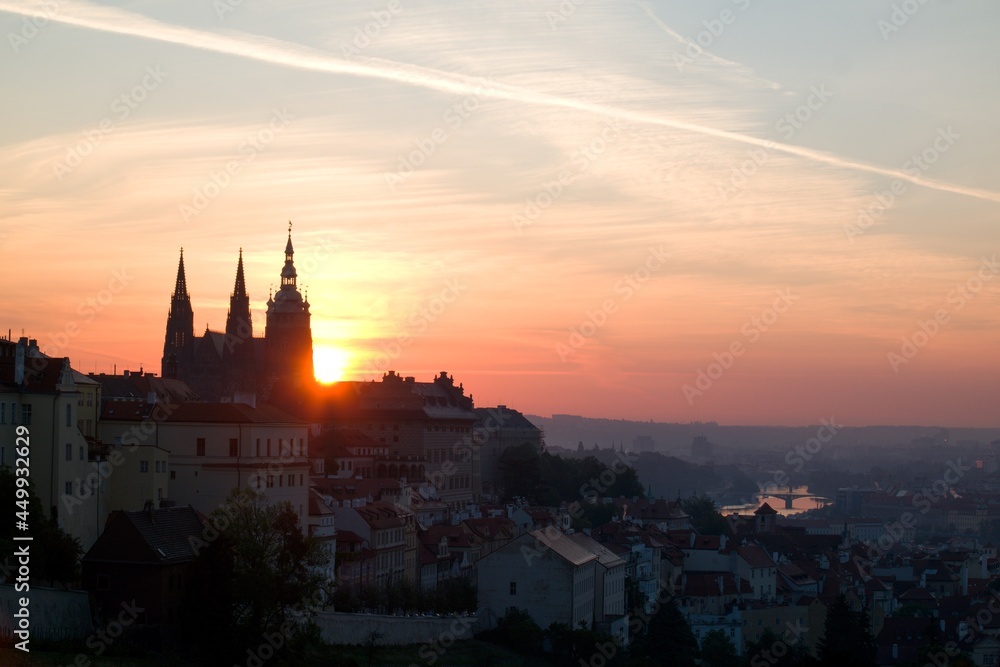 Sun rising behind the St. Vitus Cathedral at Prague Castle