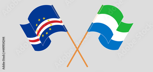 Crossed and waving flags of Cape Verde and Sierra Leone