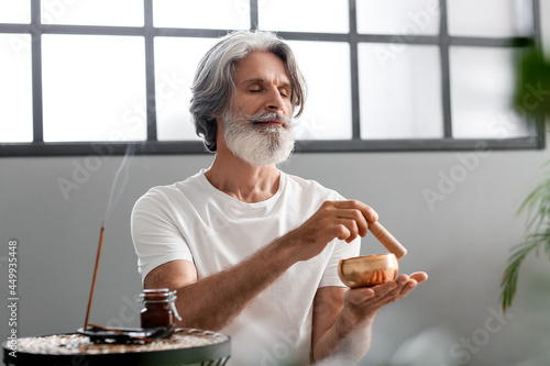 Mature man with Tibetan sin...