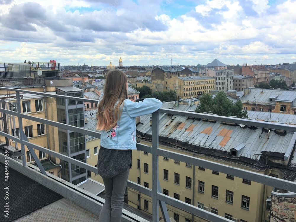 Saint Petersburg Russia, girl, roofs and sky with clouds
