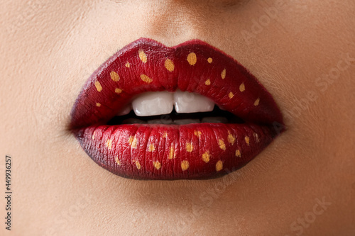 Beautiful young woman with unusual makeup, closeup
