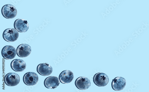 blue background with ripe blueberries