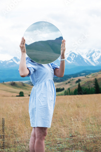 Woman in blue dress in summ...