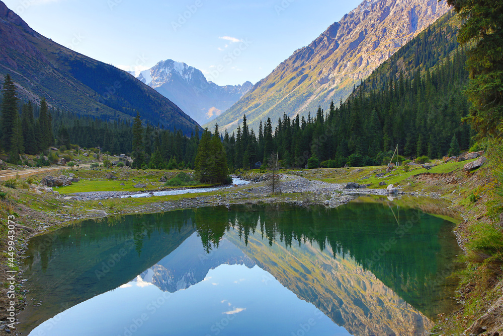 Obraz premium Reflection of the mountains in Barskaun Gorge in Kyrgyzstan