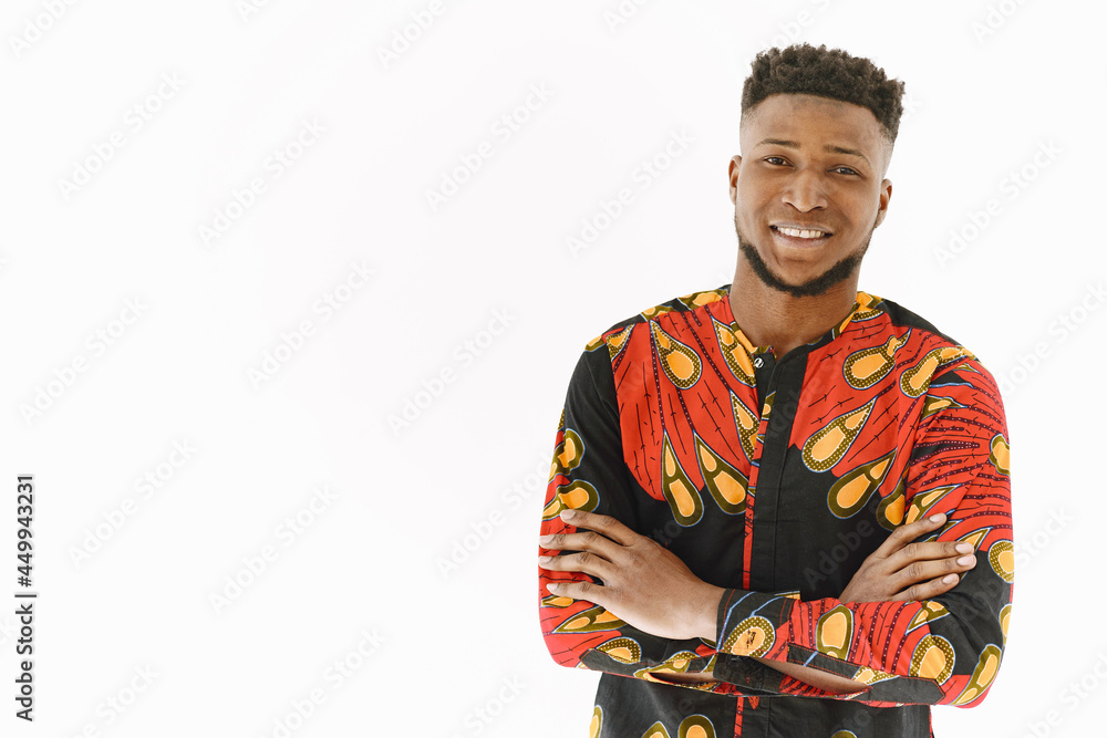 African young man posing against white wall African young man posing against white wall