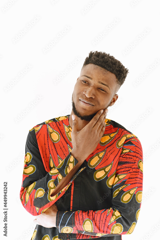 African young man posing against white wall