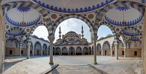 Central Mosque of Imam Sarakhsi through the arches in its courtyard, in Bishkek, Kyrgyzstan
