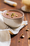 Chocolate pudding with pistachio crumbs on top