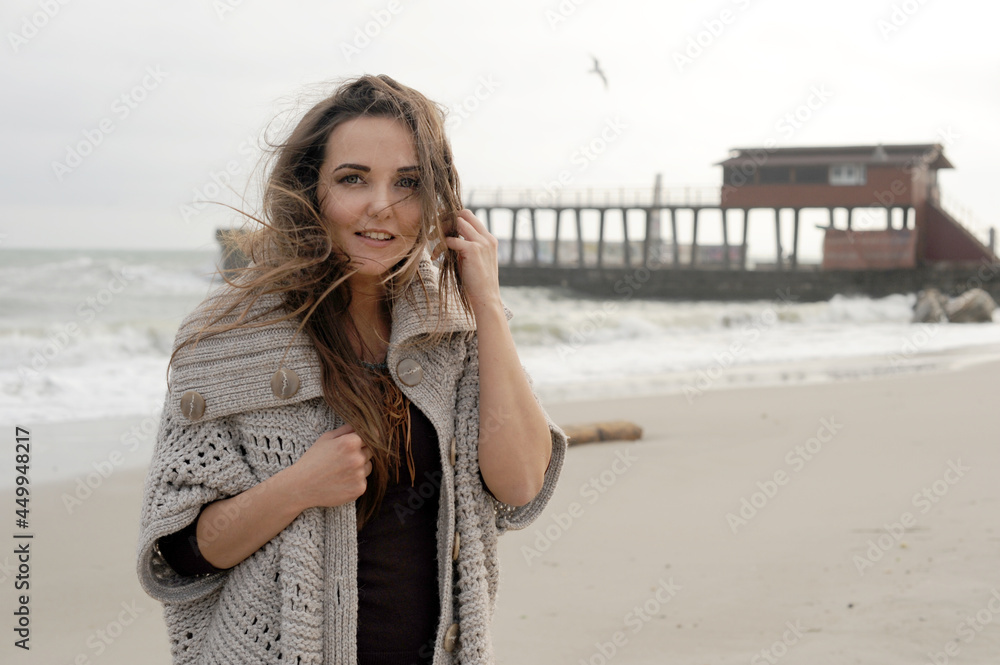 Happy smiling brunette woman portrait dressed knitted sweater, autumn outdoor photo Happy smiling brunette woman portrait dressed knitted sweater, autumn outdoor photo