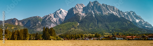 High resolution stitched panorama of a beautiful alpine summer view with the famous Zugspitze summit in the background at Grainau near Garmisch Partenkirchen, Bavaria, Germany © Martin Erdniss