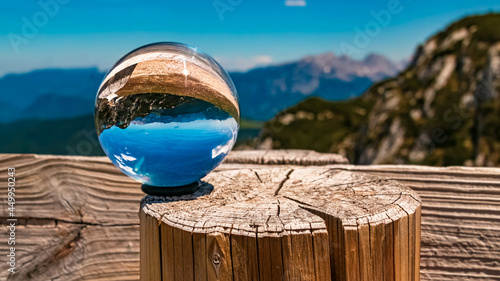 Crystal ball alpine landscape shot at the famous Steinplatte summit near Waidring, Tyrol, Austria © Martin Erdniss