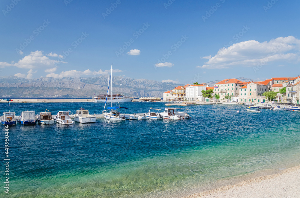 Picturesque bay and the old town of Postira. Postira lies on the northern coast of Brac island in Croatia.