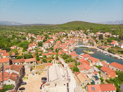View of the bay and old city with fortress and church in the town of Vrboska on Hvar island, Croatia