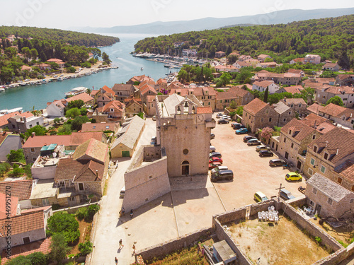 View of the bay and old city with fortress and church in the town of Vrboska on Hvar island, Croatia