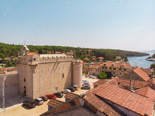 View of the bay and old city with fortress and church in the town of Vrboska on Hvar island, Croatia