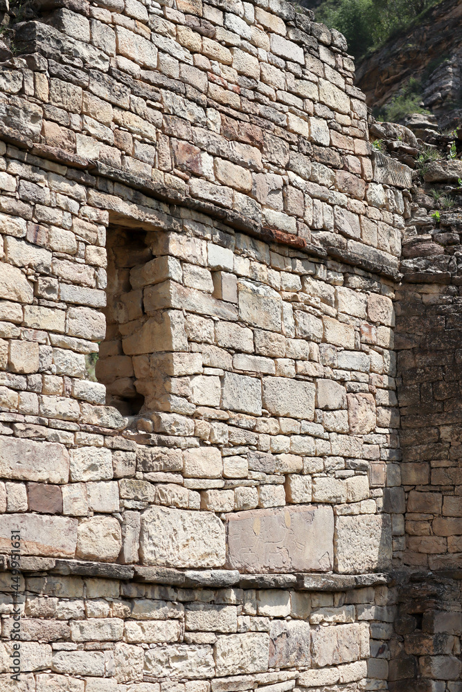 window in the old stone wall