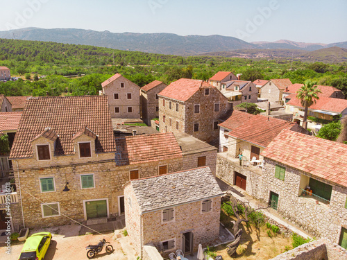 View of the bay and old city with fortress and church in the town of Vrboska on Hvar island, Croatia