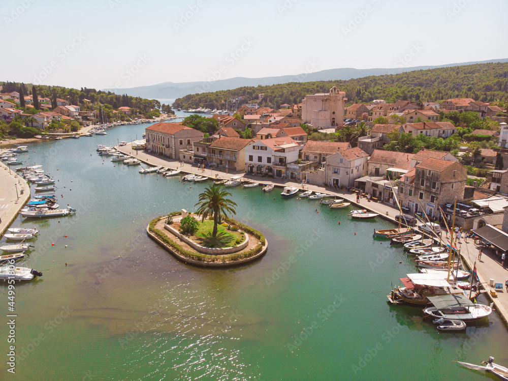 View of the bay and old city with fortress and church in the town of Vrboska on Hvar island, Croatia