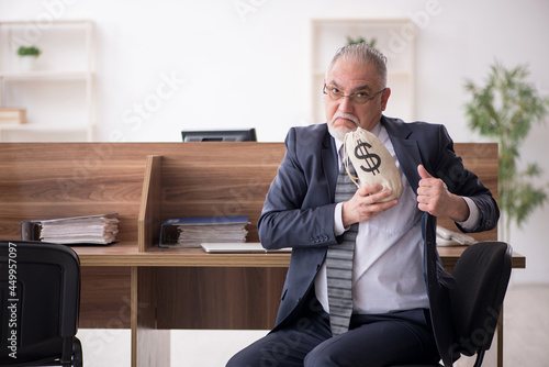 Fotografija Aged male employee in remuneration concept