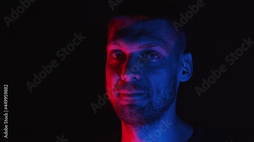 Male face showing emotions, feelings, effects, making faces, apeing. unshaved caucasian man expresses agreement, approvement, approval, consent. face emotions in the complementary colors concept.