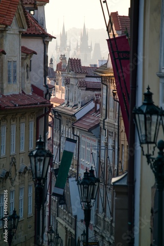 Early morning view of Prague's roofs and towers in the Nerudova street photo