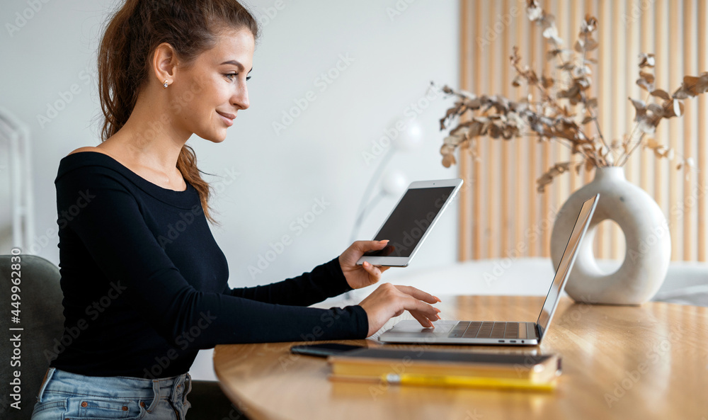 The blogger keeps records in a spreadsheet. A freelancer communicates with clients by email. A female student is studying online on a laptop at the university on a wooden table. The blogger keeps records in a spreadsheet. A freelancer communicates with clients by email. A female student is studying online on a laptop at the university on a wooden table.