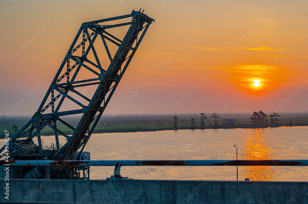 draw bridge sunrise over water