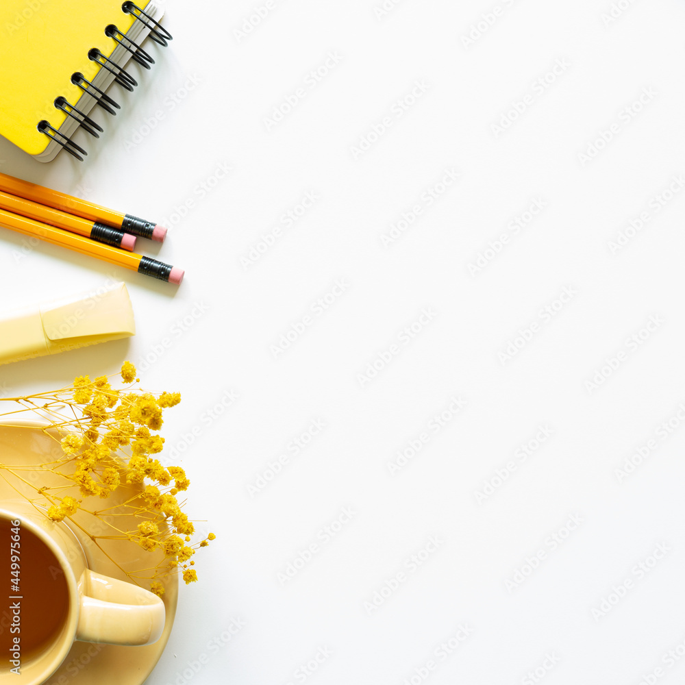 Notebook, cup of tea, pen, dry flower on white background. top view, copy space. Work and study place Notebook, cup of tea, pen, dry flower on white background. top view, copy space. Work and study place