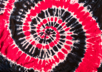 Fashionable Colorful Red, Blue and Black Retro Abstract Psychedelic Tie Dye Swirl Design on cotton shirt. 