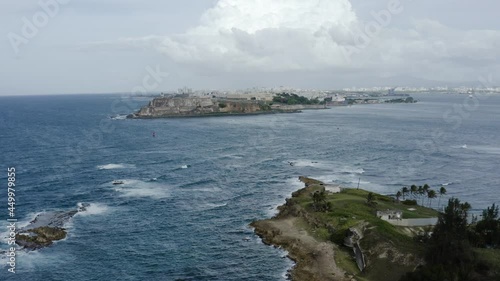 Smooth aerial pullout shot over Isla de Cabra Puerto Rico - A former leper colony now a recreation area. photo