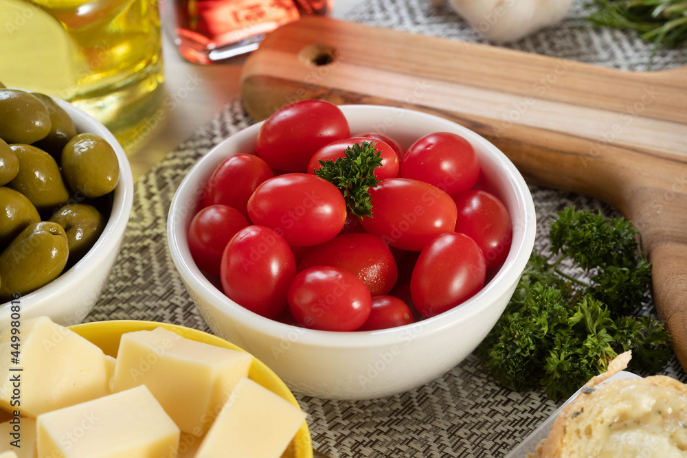 Appetizer jars with cheese, olives and cherry tomatoes Appetizer jars with cheese, olives and cherry tomatoes