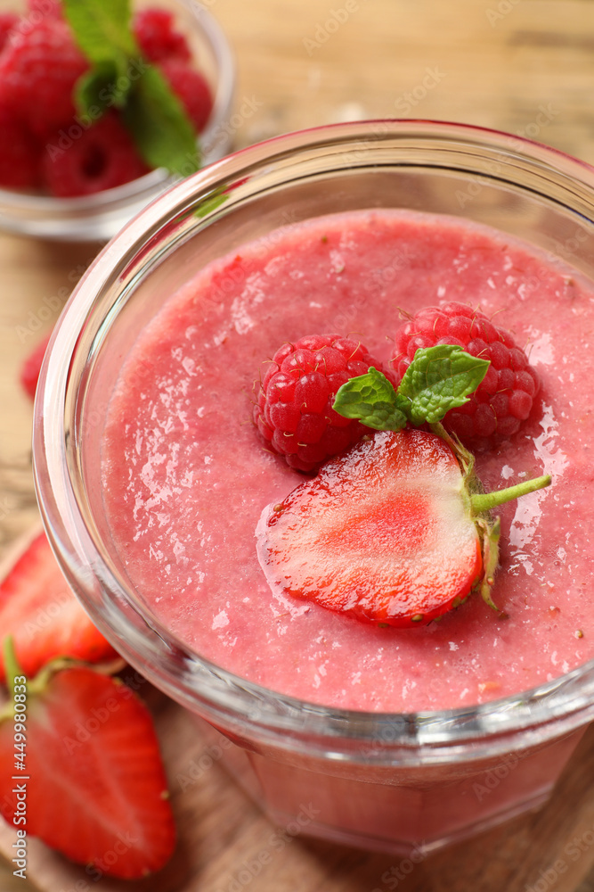 Delicious berry mousse with mint in glass dish, closeup Delicious berry mousse with mint in glass dish, closeup