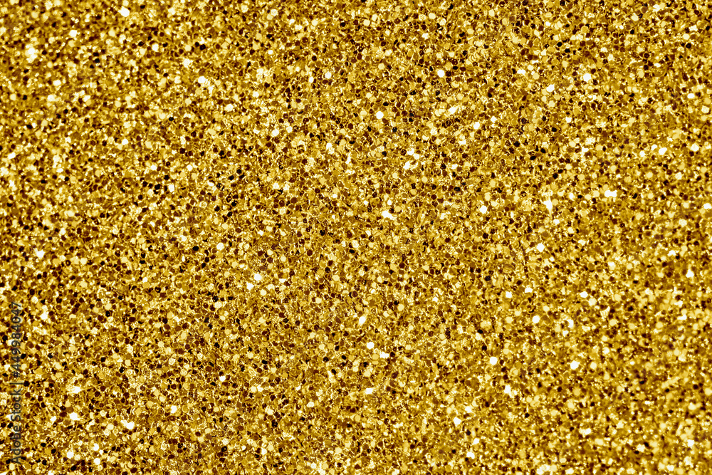 Close up of golden glitter textured background Close up of golden glitter textured background