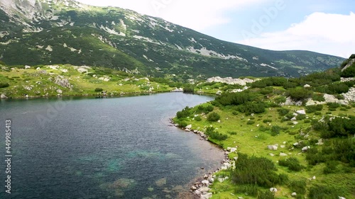 Flight over the Popovo Lake, a glacial lake situated in the northern section of the Pirin mountain range in Bulgaria.