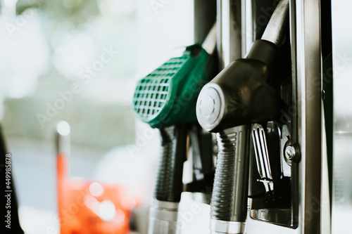 Closeup of fuel nozzles at a gas station photo