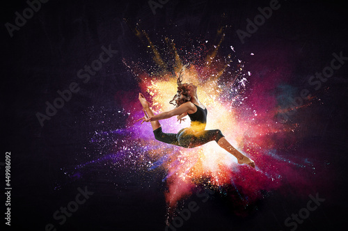 Female dancer against abstr...