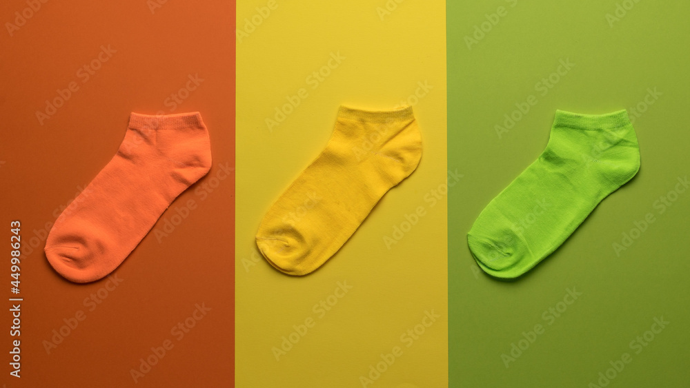 Three colored socks on a background of three colors. Three colored socks on a background of three colors.