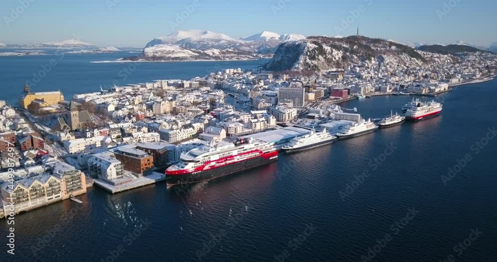 Alesund, Norway's most beautiful town is shown in this breathtaking winter time aerial time lapse that reveals art nouveau style buildings, amazing nature, fjords and mountains around it. Alesund, Norway's most beautiful town is shown in this breathtaking winter time aerial time lapse that reveals art nouveau style buildings, amazing nature, fjords and mountains around it.