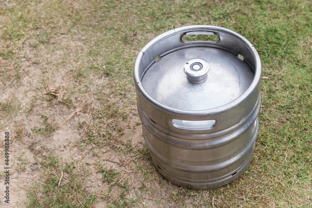 photo of Equipment for the production of beer. new a keg with fresh beer. metal beer keg container working in street festival. photo of Equipment for the production of beer. new a keg with fresh beer. metal beer keg container working in street festival.