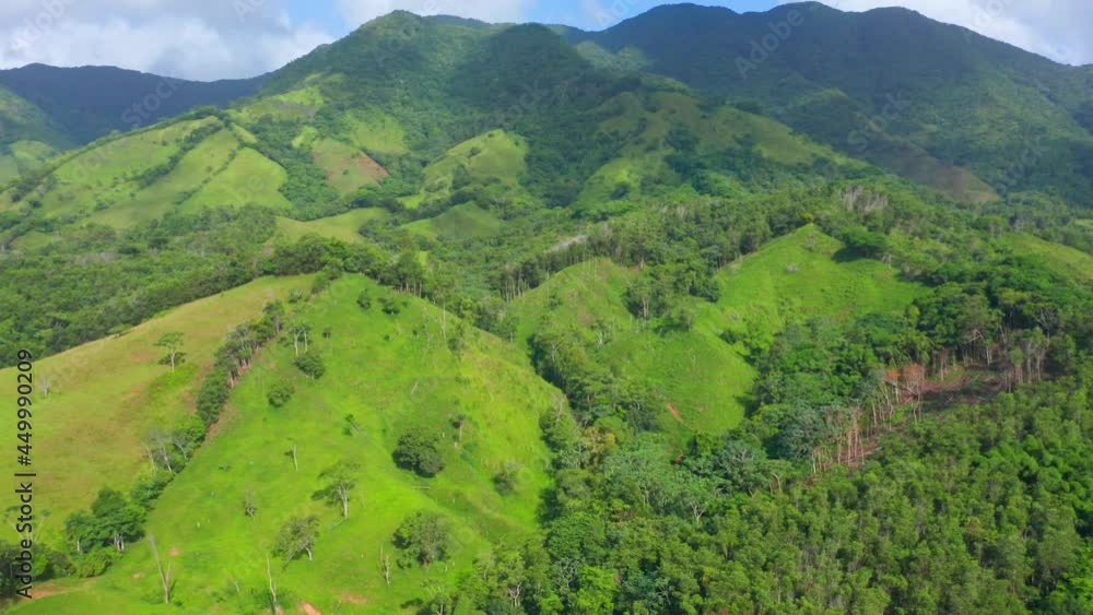 Unspoiled Dominican green hills and mountains of Los Mogotes of Villa Altagracia. Aerial circling
Unspoiled Dominican green hills and mountains of Los Mogotes of Villa Altagracia. Aerial circling