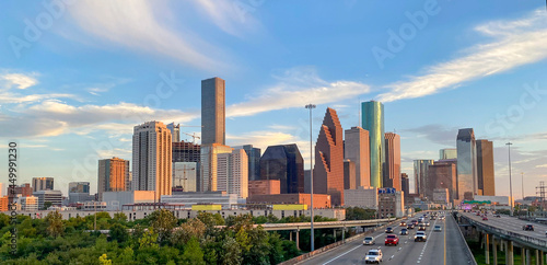 Houston skyline at twilight with freeway traffic in foreground. photo