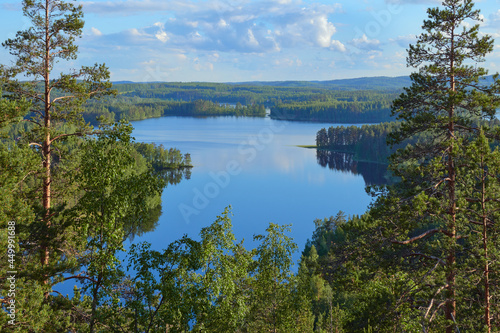 Summer view from the Neitvuori mountain in Finland to the lake and forest. © ROMAN BELIAKOV