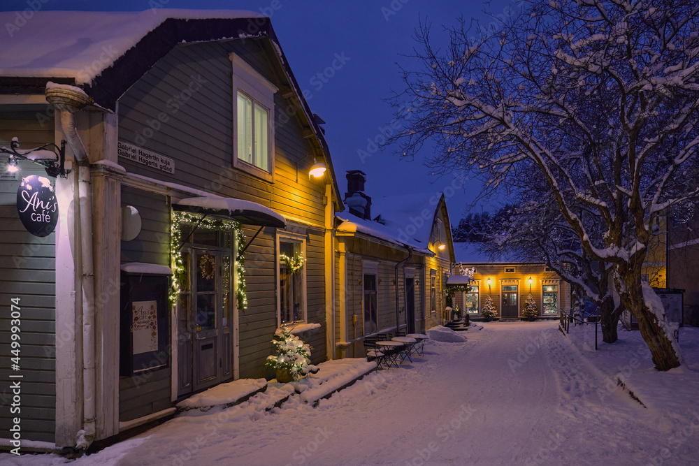 Winter evening in Porvoo, old wooden houses on the streets of the old town. 