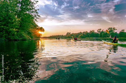 Photography Sea kayakers paddle into the setting sun  on Long Pond on the Toronto Islands on a summer evening