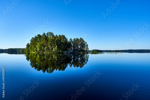 Reflection in still lake © PekkaLinna