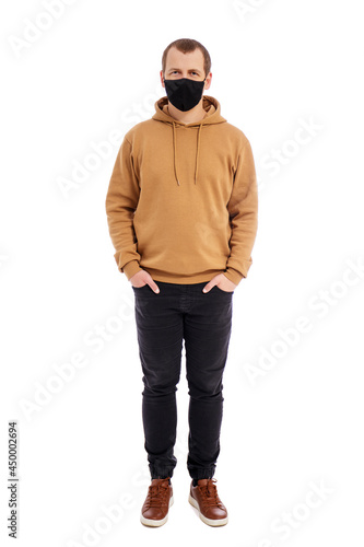 full length portrait of handsome man in sports wear and black mask isolated on white background