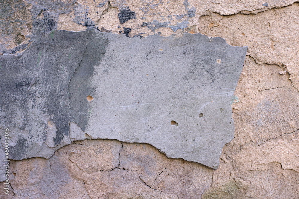Fototapeta premium Old dirty wall close up. Grunge abstract photo background. Beautiful stone texture pattern.