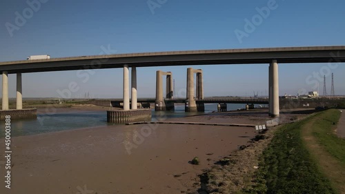 Vehicles Driving Through Kingsferry Bridge In The Isle Of Sheppey In Kent, England - panning shot photo